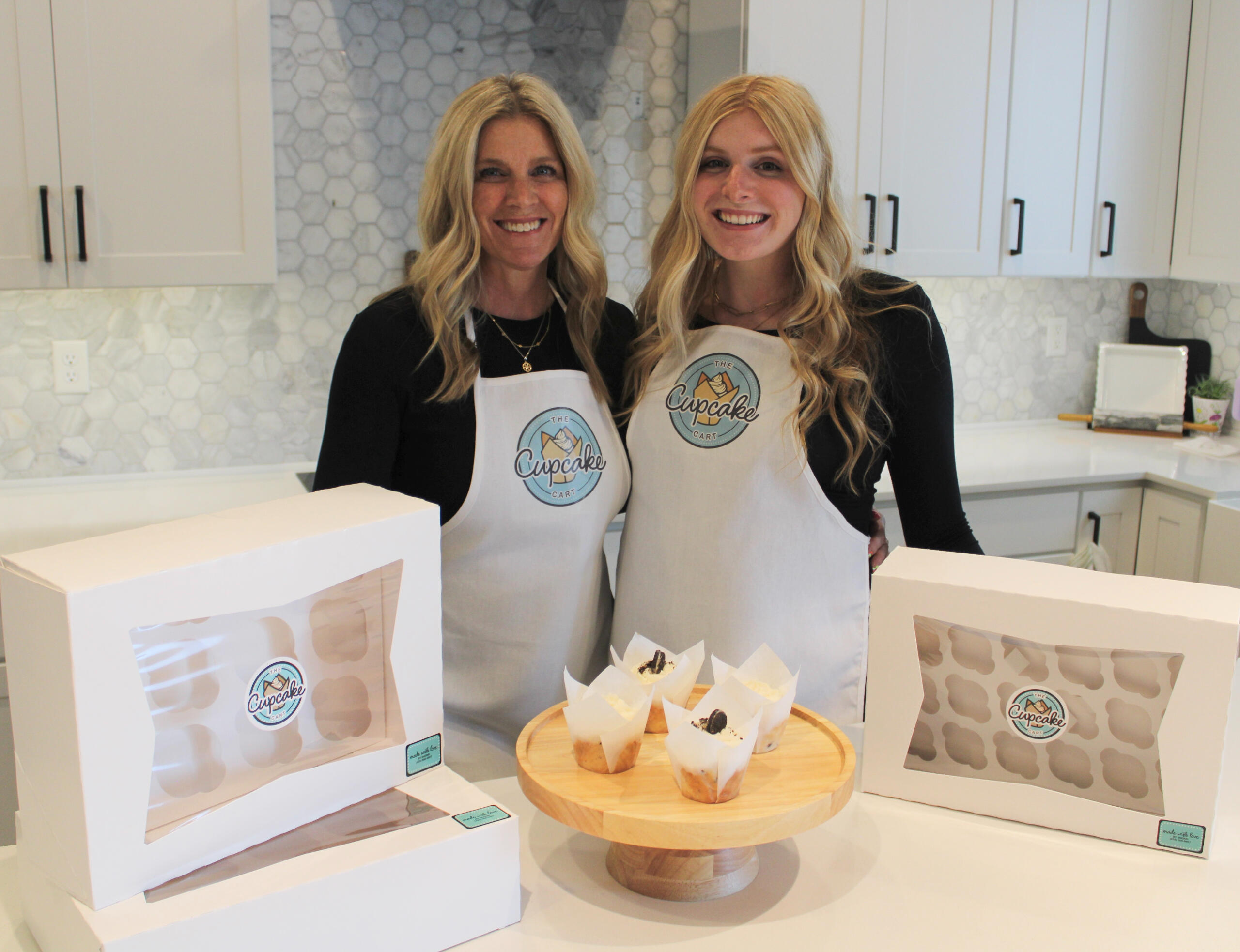 Sherri and Hallie baking in The Cupcake Cart kitchen